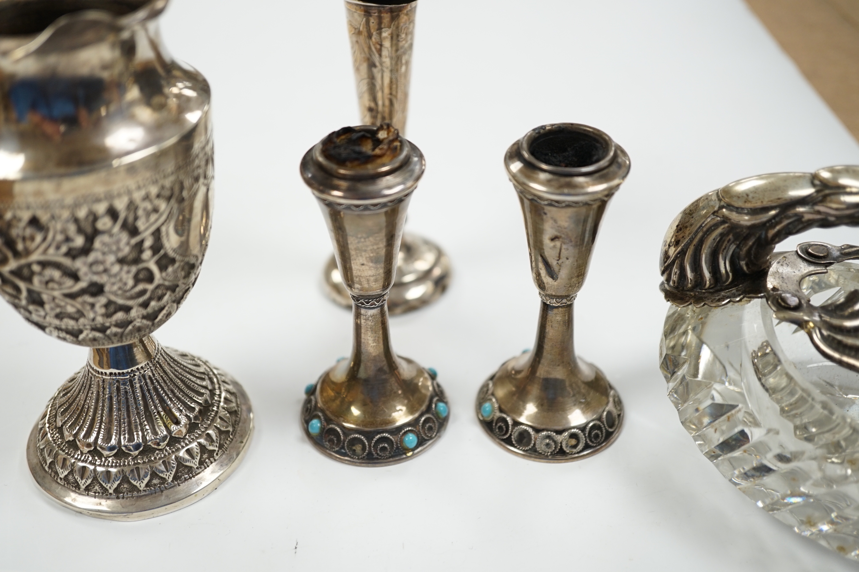 Two small white metal candlesticks, 8cm, an Indian vase, silver posy vase and a white metal mounted glass swan dish, a.f.